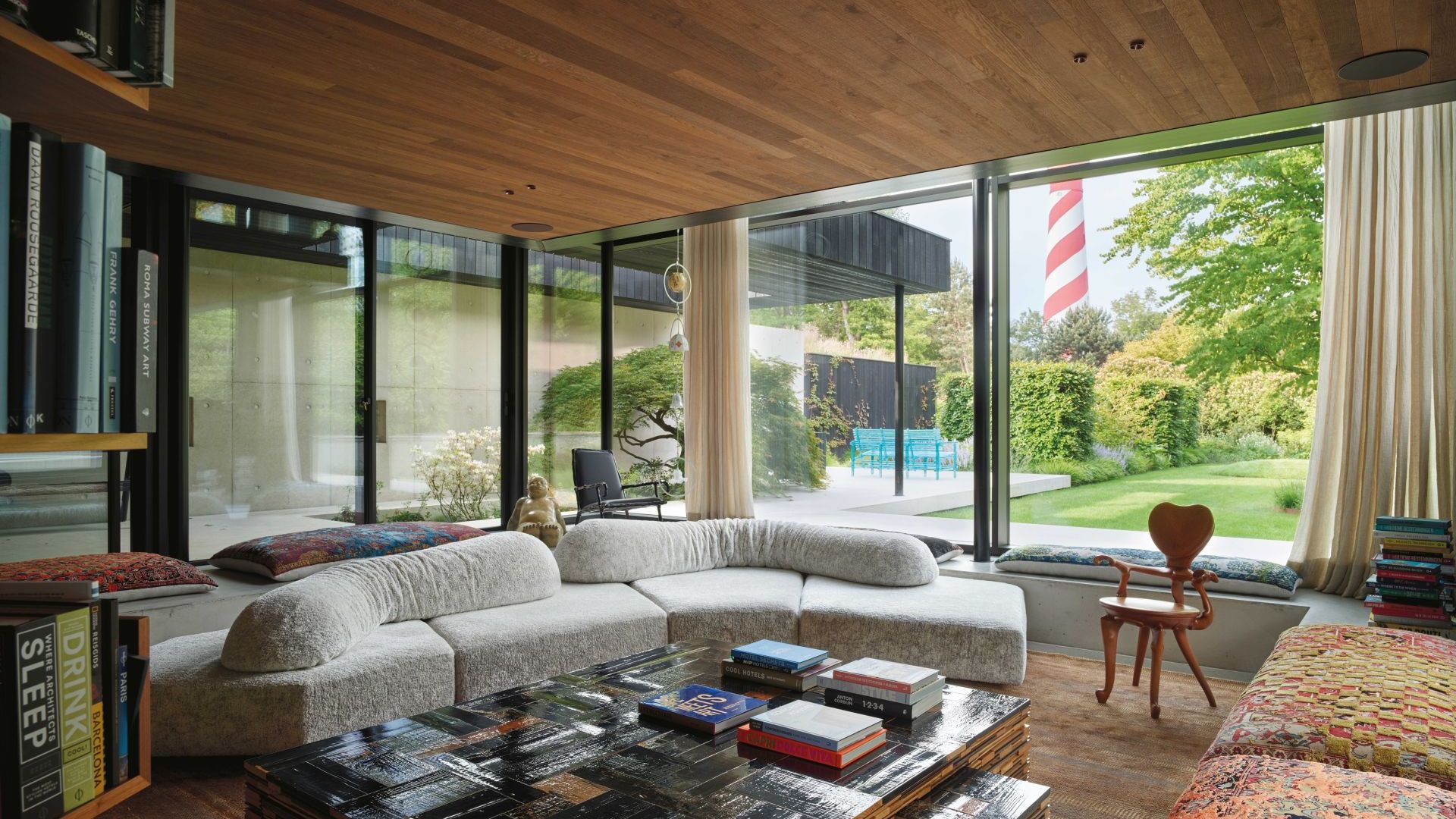   On the Rocks. &nbsp;The sofa opens up a 360-degree view of the landscape in the villa&rsquo;s living area. Artworks by Maarten Baas, Piet Hein Eek and Anton Gaud&igrave;. 