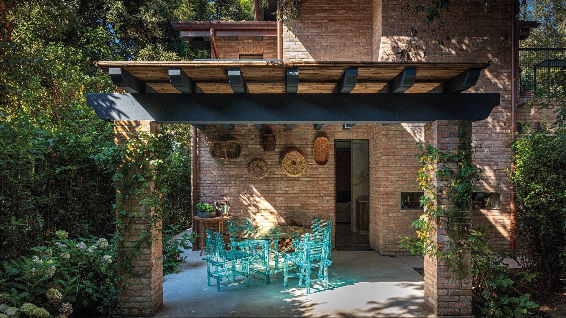   A'mare . The chairs and the dining table in the patio that gives on the kitchen. 