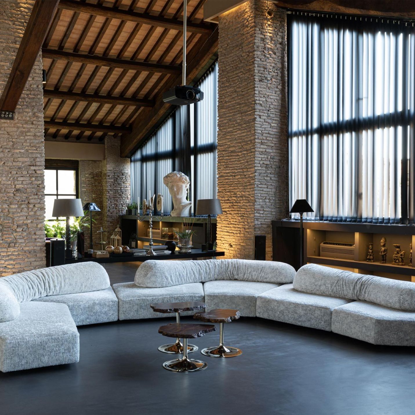   On the Rocks  &  Cicladi .&nbsp;Francesco Binfar&eacute;&rsquo;s sofa and Jacopo Foggini&rsquo;s tables in the hall. 