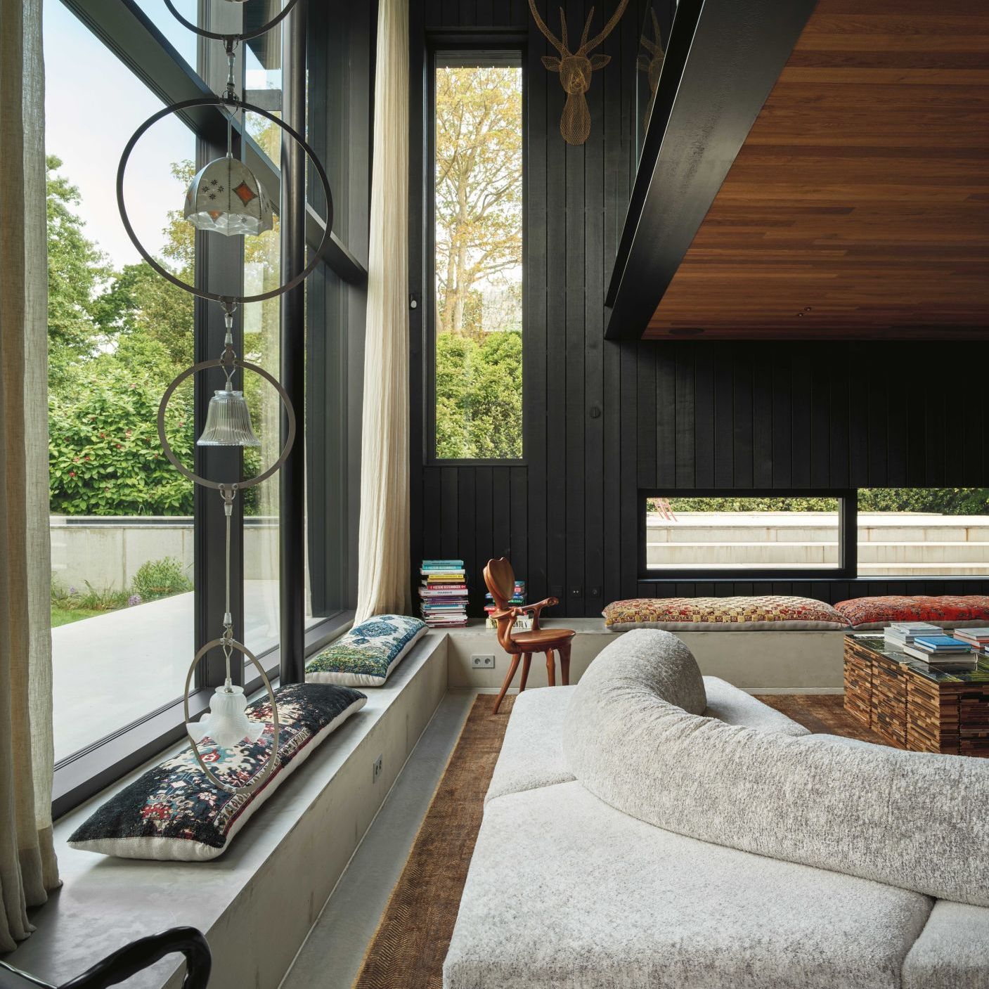   On the Rocks. &nbsp;The sofa opens up a 360-degree view of the landscape in the villa&rsquo;s living area. Artworks by Maarten Baas, Piet Hein Eek and Anton Gaud&igrave;. 
