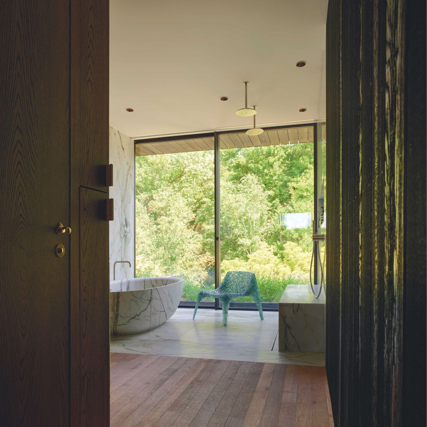   Veronica . The chair furnishes the precious marble and wood main bathroom 